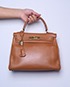 Kelly Retourne 28cm Veau Courchevel Leather in Gold, front view